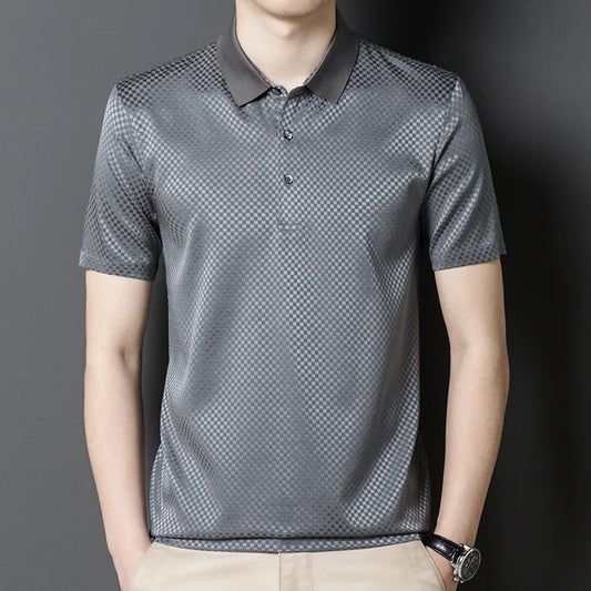 Men's Mulberry Silk Polo in shuttle grey, featuring a checkered jacquard design and a blend of 92% silk and 8% spandex. This shirt combines style and practicality with no-iron technology for easy care, ideal for refined settings -Borcelleclothes.