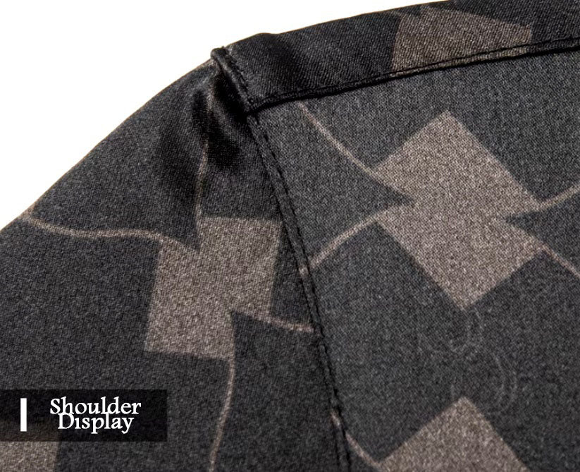 Detailed stitching and textured fabric on the shoulder of the Men's Mulberry silk shirt in deep brown, featuring a geometric rhombus mesh pattern with subtle variations in size and depth. Crafted from a blend of Mulberry silk and spandex, the shirt exudes refined elegance with a modern, structured design. From Borcelleclothes.