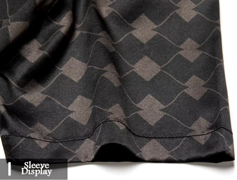 Detailed stitching and textured fabric on the sleeve of the Men's Mulberry silk shirt in deep brown, featuring a geometric rhombus mesh pattern with subtle variations in size and depth. Crafted from a blend of Mulberry silk and spandex, the shirt exudes refined elegance with a modern, structured design. From Borcelleclothes.