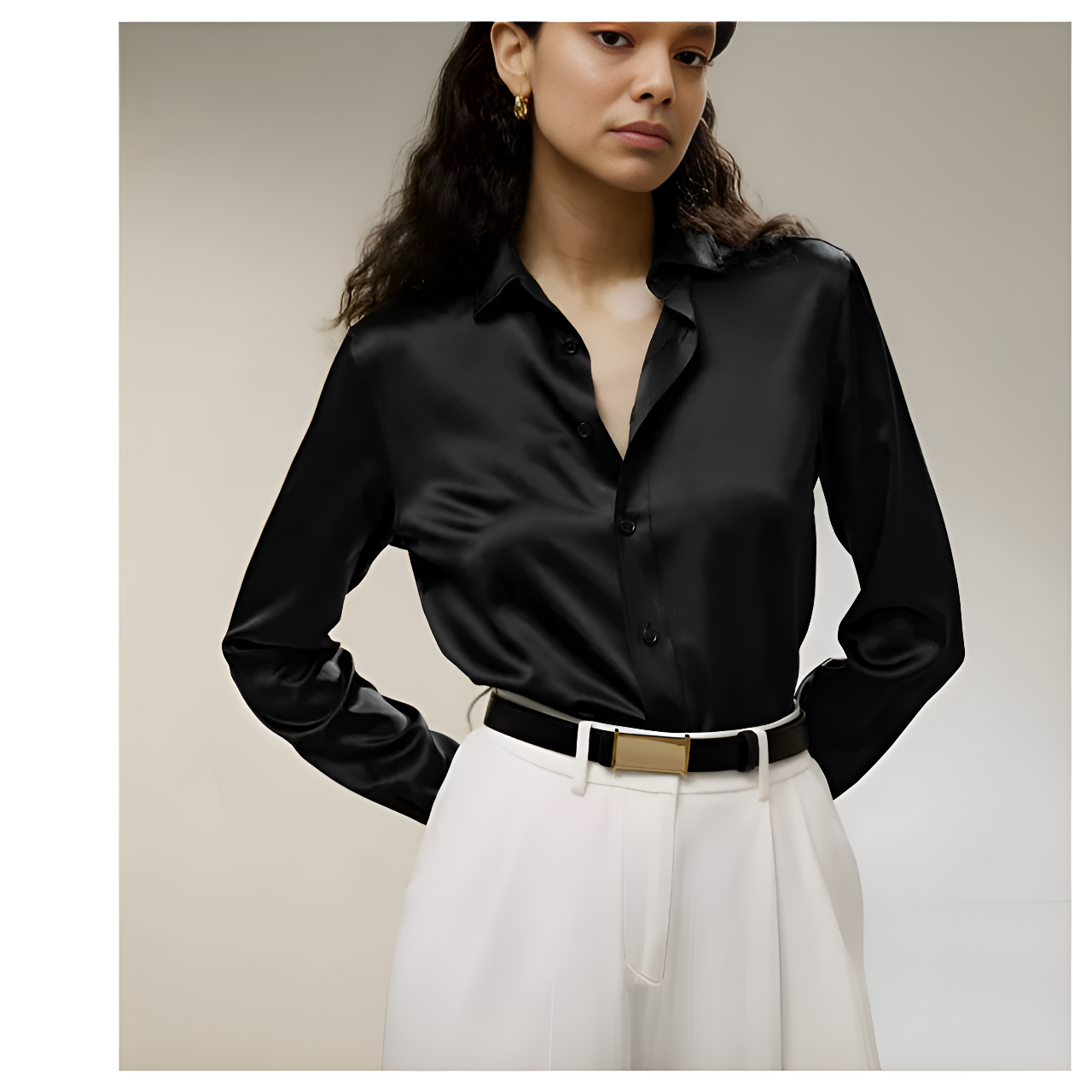 Model wearing the Women's Business Midweight Satin Silk Shirt in Onyx, crafted from 100% Mulberry silk with a smooth, lustrous finish. The model holds her arms behind, highlighting the shirt's graceful drape and refined elegance, perfect for professional or formal occasions. From Borcelleclothes.