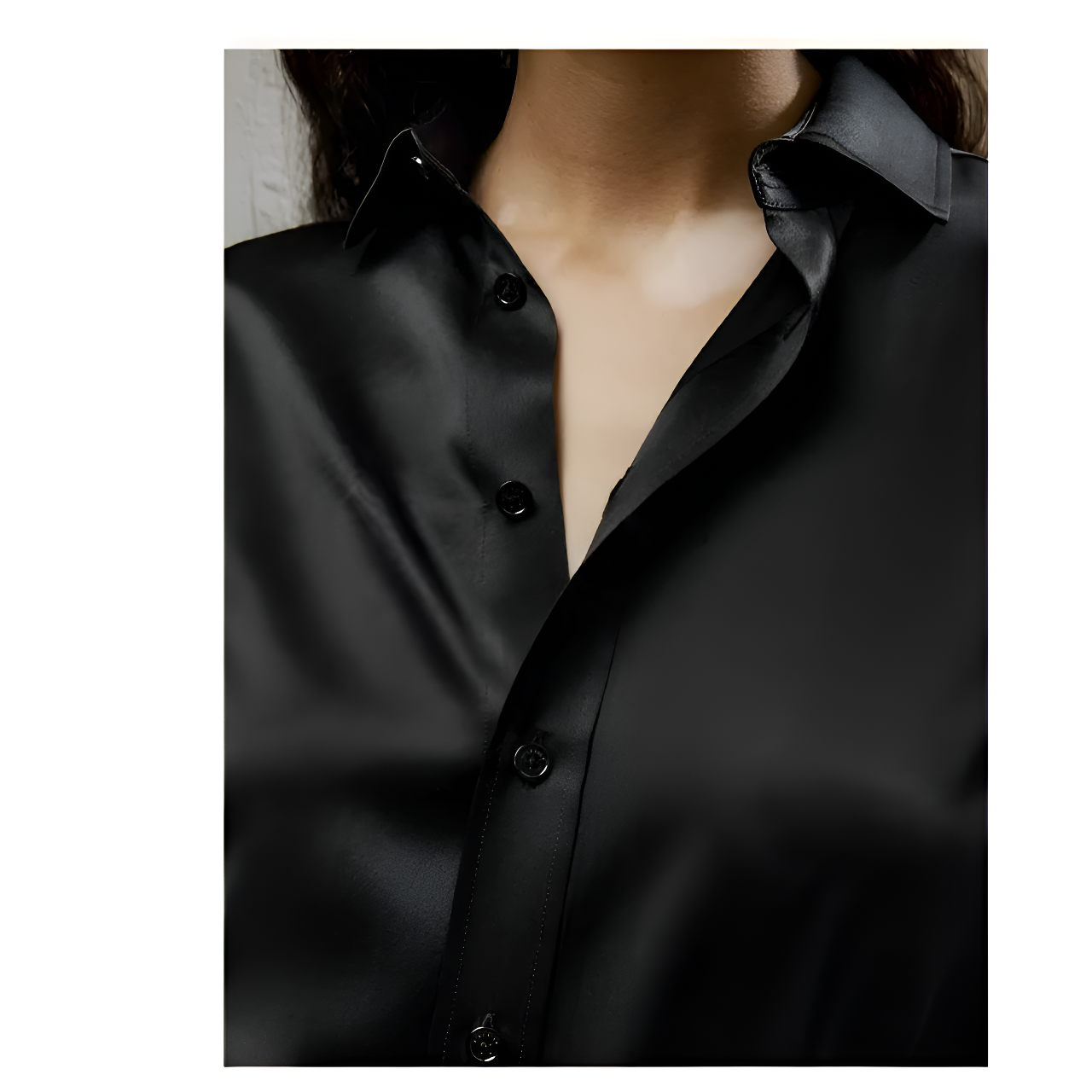 Detailed stitching and textured fabric on the part of the placket of a Women's Business Midweight Satin Silk Shirt in Onyx, crafted from 100% Mulberry silk with a luxurious midweight satin finish. The shirt showcases a smooth, lustrous texture that offers elegance and sophistication, ideal for formal and professional settings. From Borcelleclothes.
