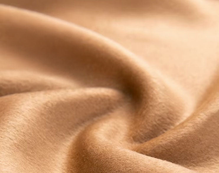 The Burning Sand cashmere fabric, highlighting the 70% cashmere and 30% high-count wool blend with its natural sheen and soft drape. From Borcelleclothes.