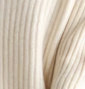 Luxurious draping of cashmere fabric in Soft Amber, highlighting its softness, warmth, and smooth texture, Borcelleclothes.