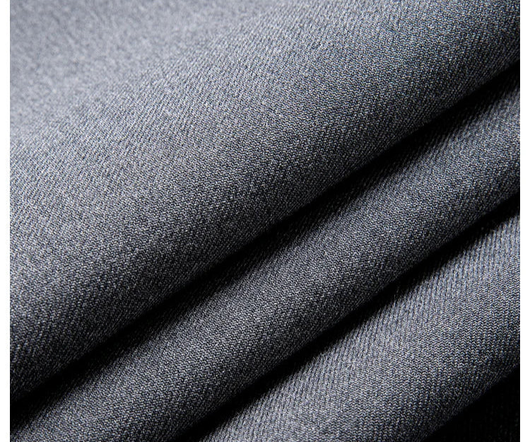 Close-up of Davy Grey blazer fabric with folded texture, smooth polyester-viscose surface. From Borcelleclothes.