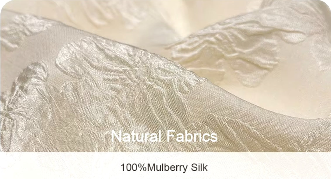 Close-up of Pearl Bush jacquard silk fabric showing texture and composition. From Borcelleclothes.