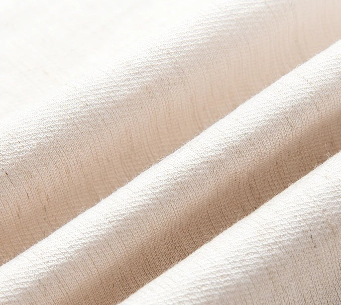 Wave-folded texture of the Bon Jour fabric in a soft undefined shade, showing matte, breathable surface. From Borcelleclothes.