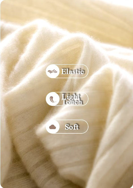 Demo of the cashmere fabric in Merino color, highlighting its elasticity, lightweight feel, and soft texture. From Borcelleclothes.