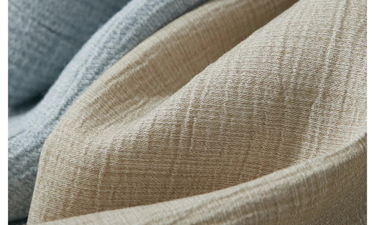 Fabric samples of crinkled viscose in Morning Blue and Soft Amber textures – From Borcelleclothes.