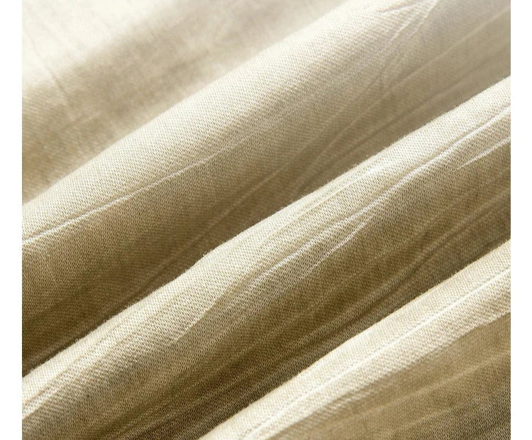 Wave-folded Shadow fabric sample revealing its soft crinkled texture. From Borcelleclothes.