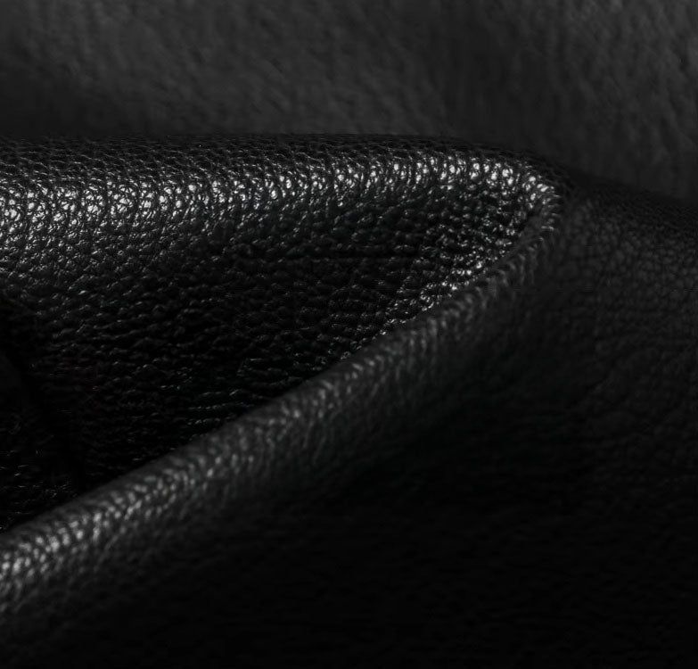 Goatskin leather texture in the Onyx version; reveals natural grain with subtle sheen and firm structure. From Borcelleclothes.