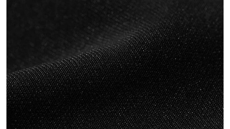 Fabric texture detail of Onyx minimal blazer in deep black Onyx tone – From Borcelleclothes.