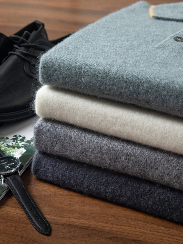 Stack of Alashan cashmere polos — four shades folded to reveal knit quality and color depth. From Borcelleclothes.