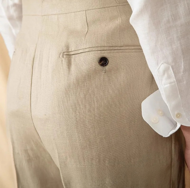 Back upper view of linen trousers in Soft Amber, focusing on the smooth fit and minimal waistband design. From Borcelleclothes.