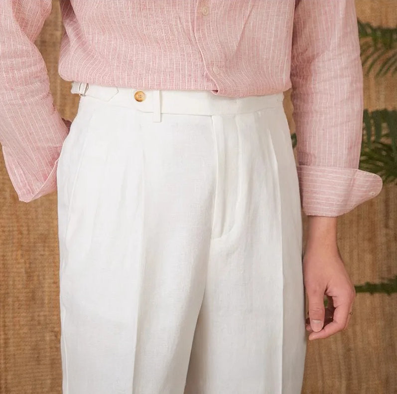 Upper front view of 100% linen trousers in Wild Sand, featuring muted tones and precise pleating. From Borcelleclothes.