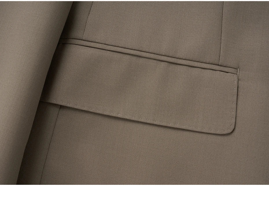 Close-up of flap pocket on the Almond Frost blazer, featuring precise stitching. From Borcelleclothes.