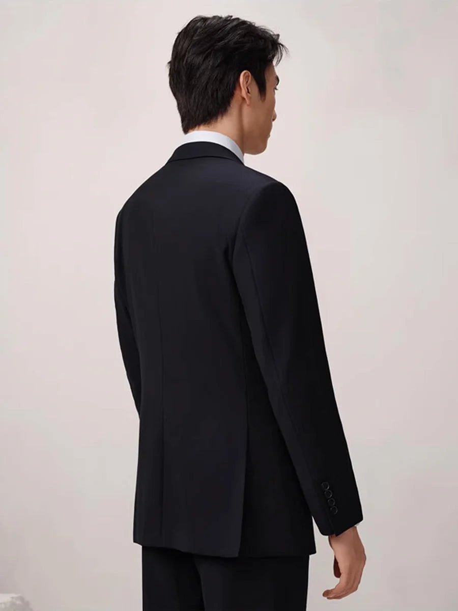 Back view of the Baltic Sea wool suit showing the blazer’s double vent and precise shoulder construction. From Borcelleclothes.
