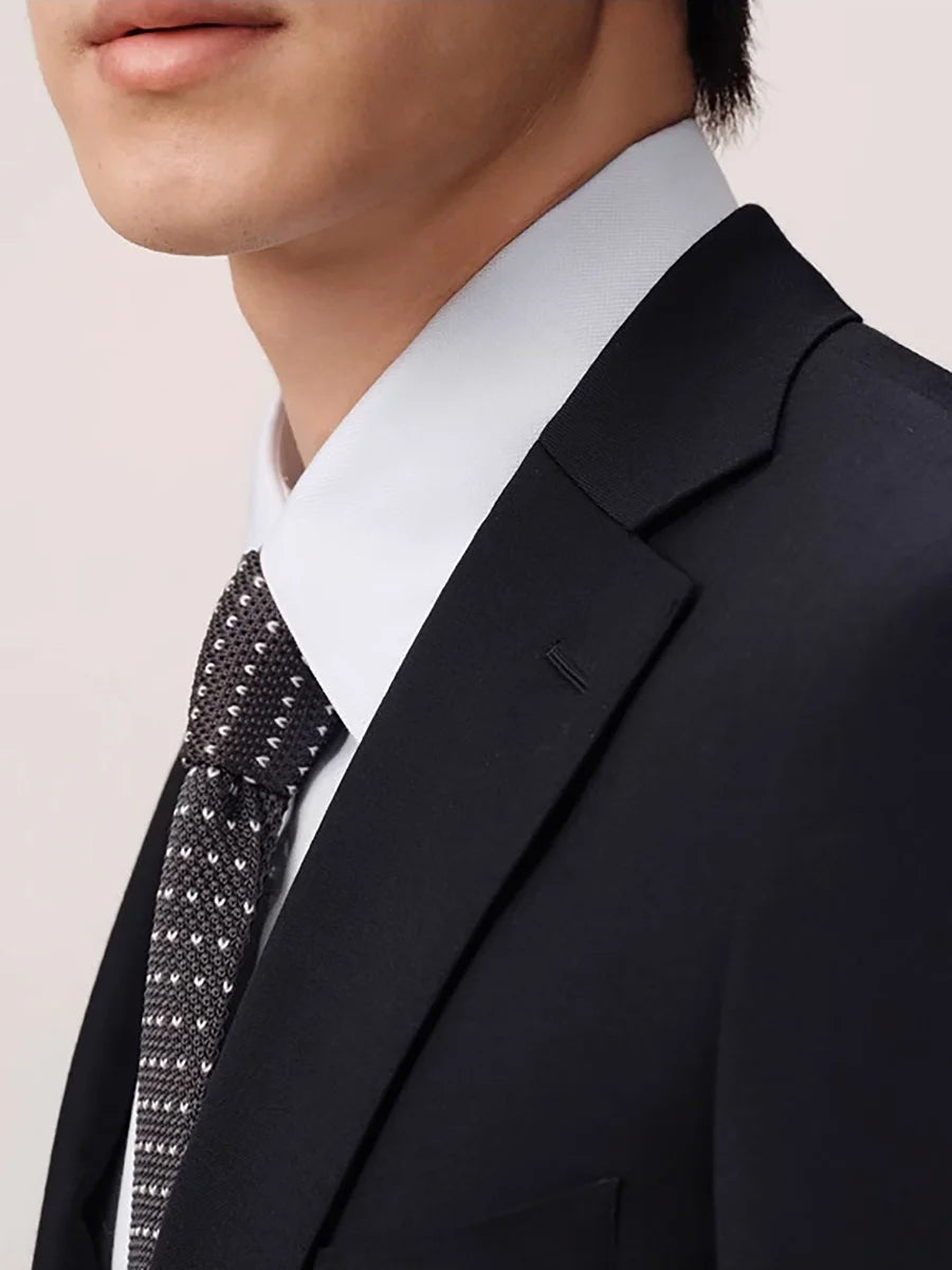 Close-up of the Baltic Sea wool suit blazer with notch lapels, tonal buttons, and hand-stitched buttonhole. From Borcelleclothes.