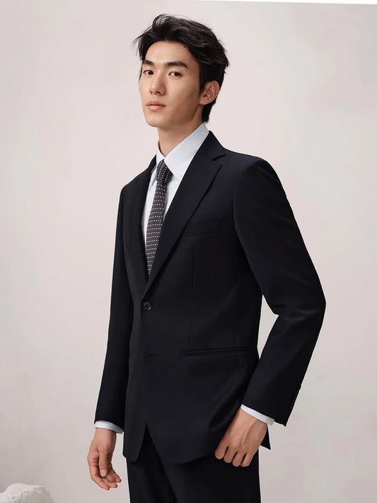 Men’s wool suit in Baltic Sea color featuring a single-breasted blazer and slim cropped trousers, crafted from 100% wool with refined tailoring and discreet adjusters. From Borcelleclothes.