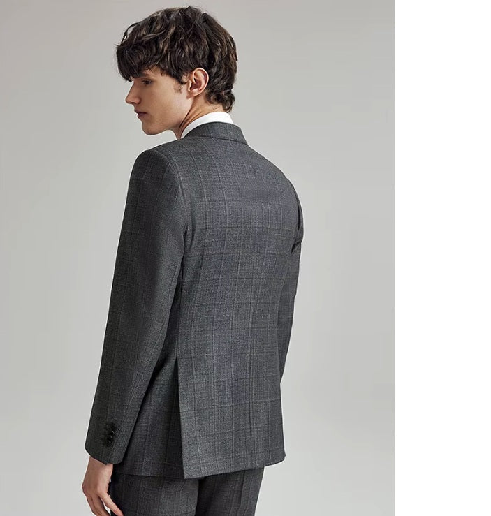Back of the Borcelleclothes Men's Bright Grey 3-Piece Plaid Suit, emphasizing the double vent and clean silhouette of the blazer.
