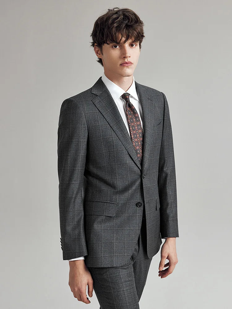 Model wearing the Borcelleclothes Men's Bright Grey 3-Piece Plaid Suit, turned slightly to the side, showcasing the clean lines and subtle plaid pattern.