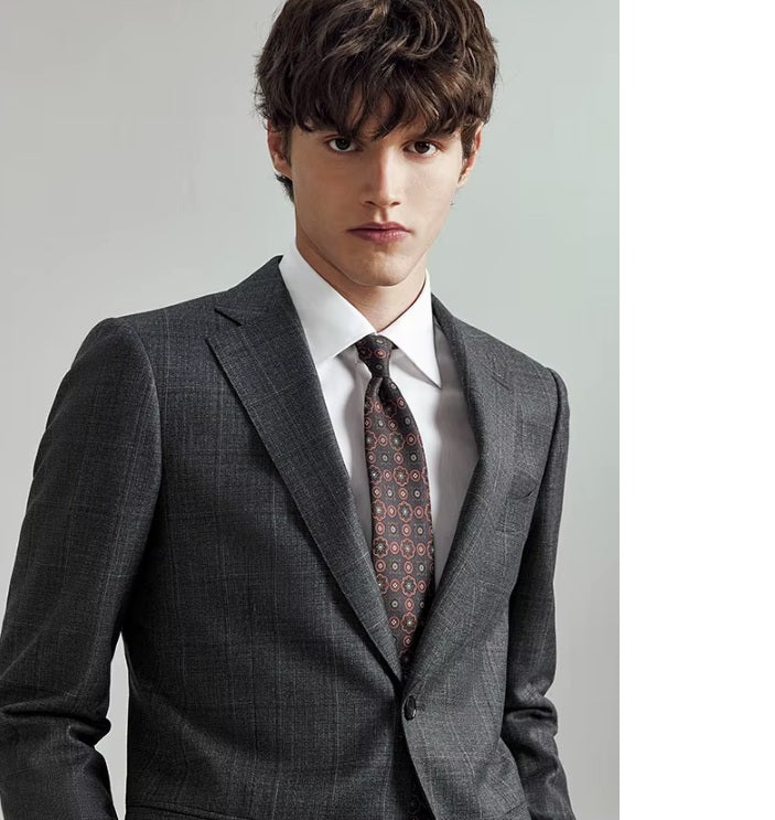The upper part of the Borcelleclothes Men's Bright Grey 3-Piece Plaid Suit, focusing on the notch lapels and tailored blazer design.
