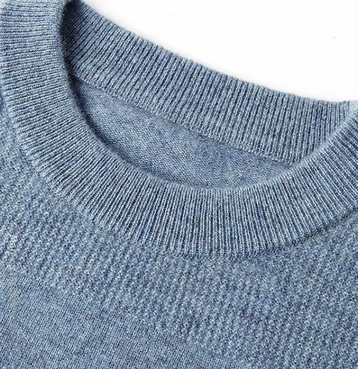 The ribbed crew neck on the Men's Cashmere Crew Neck Sweater in Rock Blue, showcasing its polished and timeless design. From Borcelleclothes.