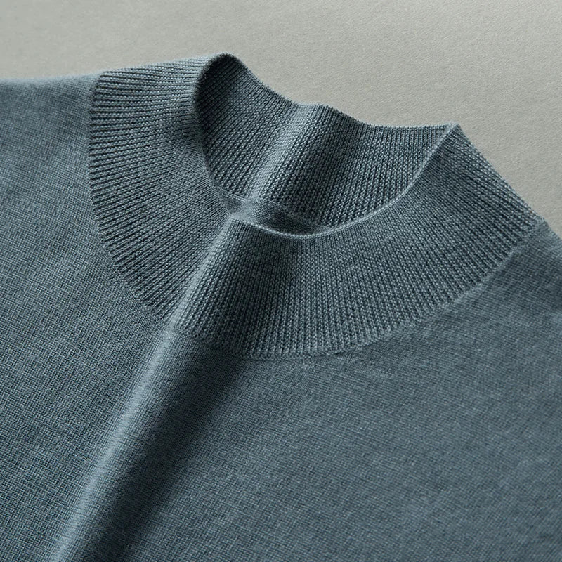 Close neckline detail of the Sea Swell cashmere mock neck sweater in 1x1 ribbing — From Borcelleclothes.