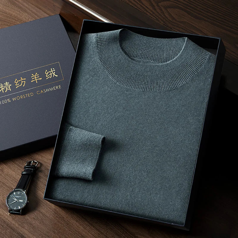 Men’s slim-fitting cashmere sweater in Sea Swell, featuring plain stockinette stitch with mock neck, dropped shoulders, and ribbed edges — From Borcelleclothes.