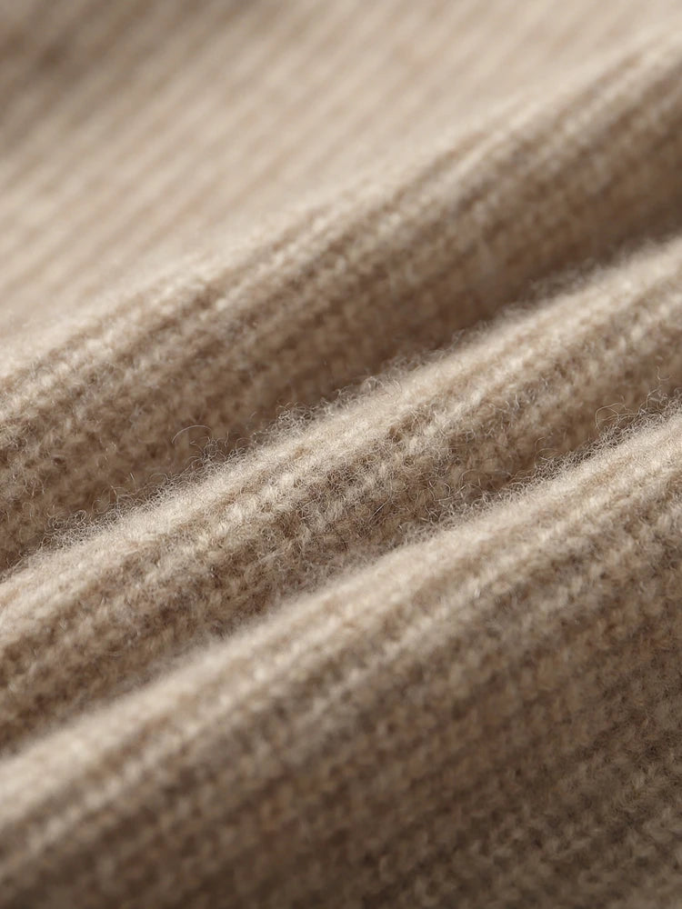 Folded texture of the men’s Dark Vanilla cashmere sweater revealing fine knit — From Borcelleclothes.