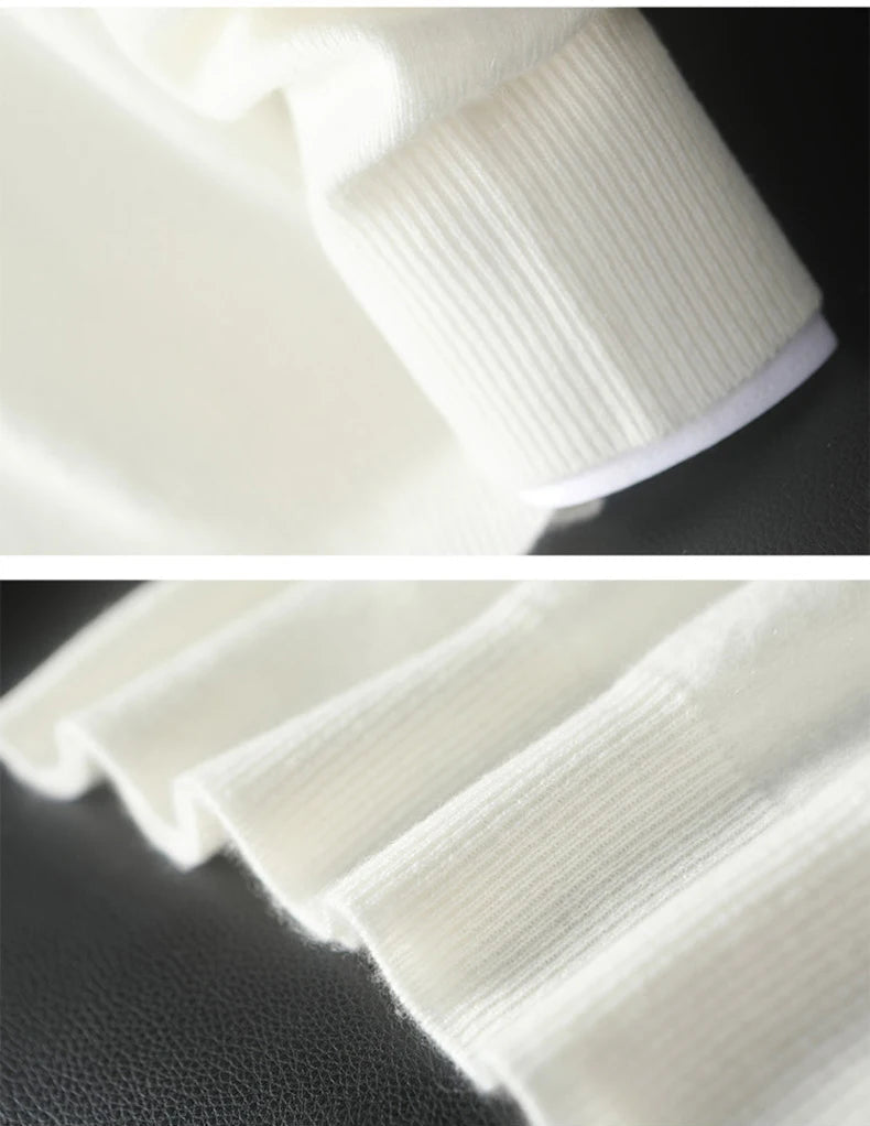 Men’s cashmere sweater in Alabaster, collage with ribbed cuff and hem details — From Borcelleclothes.