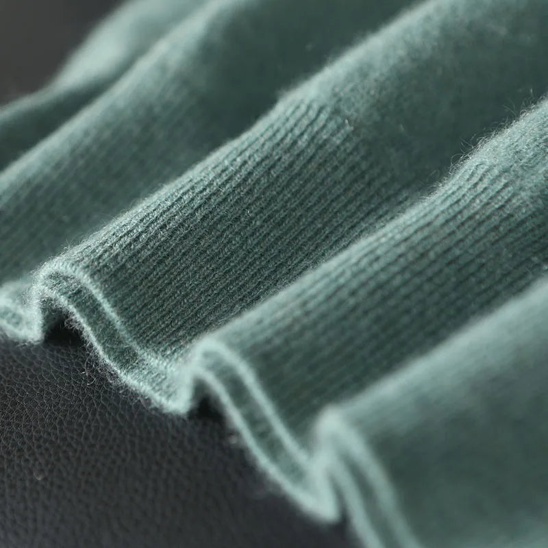 Men’s cashmere sweater in Opal, ribbed bottom hem detail — From Borcelleclothes.