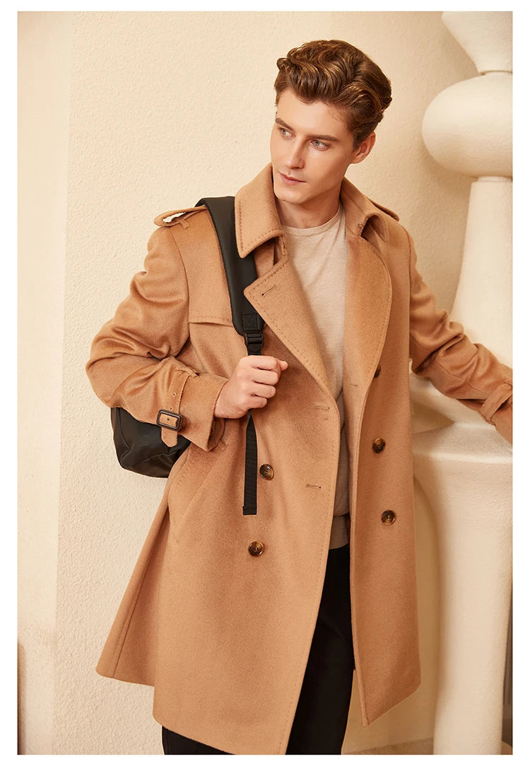Model wearing the Men’s Cashmere Trench Coat in Burning Sand, carrying a bag behind, showcasing the coat’s structured yet fluid drape. From Borcelleclothes