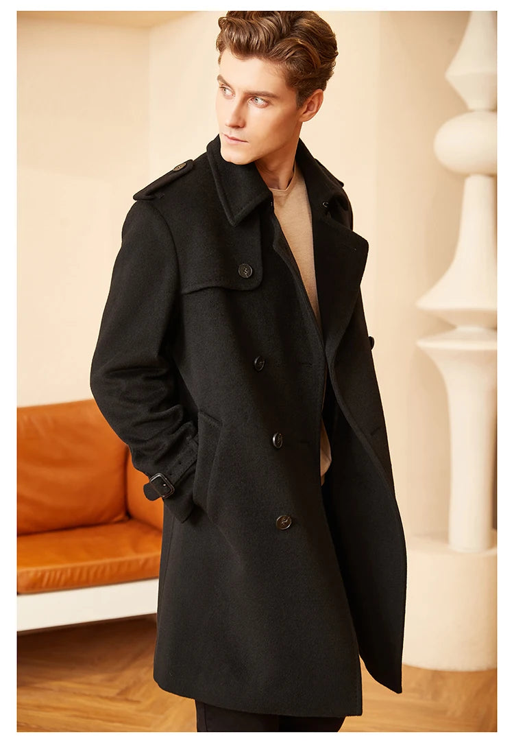 Model wearing the Men’s Cashmere Trench Coat in Onyx, gazing to the side. Showcasing the refined drape and structured silhouette. From Borcelleclothes.