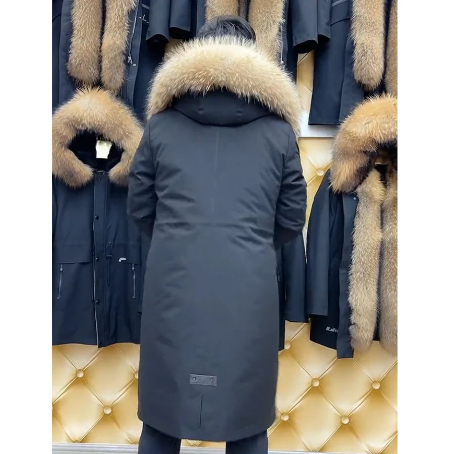 Back view of men’s River Bed coat featuring central decorative split with rubberized placket and full-length drape. From Borcelleclothes.