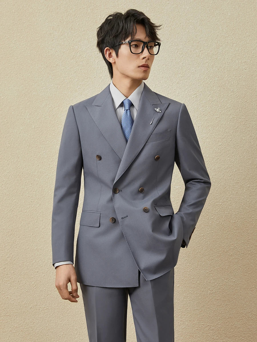 Model wearing the Comet Classical Suit, gazing to the side, highlighting the fluidity of the silhouette. From Borcelleclothes.