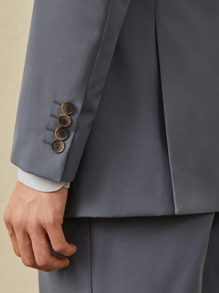 Close-up of blazer sleeve in Comet suit, featuring decorative buttons and tonal stitching. From Borcelleclothes.