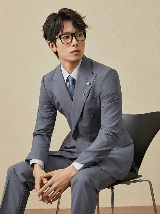 Men’s Comet-colored double-breasted suit with classic tailoring and multilayered tone, worn by a model whose presence evokes a new kind of elegance. From Borcelleclothes.