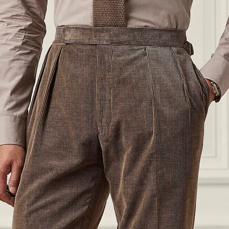 Close view of the front upper part of the Cioccolato corduroy trousers, showing pleats and side adjusters. From Borcelleclothes.