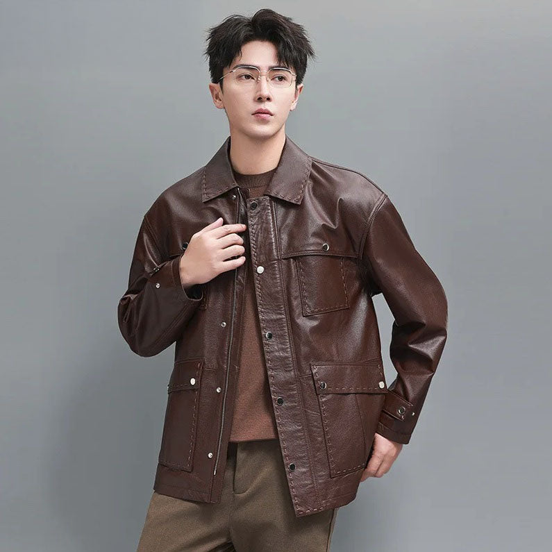 Model wearing the Rose Ebony leather jacket, hand resting on the placket; highlights decorative topstitching and refined craftsmanship. From Borcelleclothes.