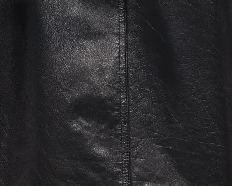 Genuine cowhide leather texture in Onyx for men’s jacket with Nutmeg accents — From Borcelleclothes.
