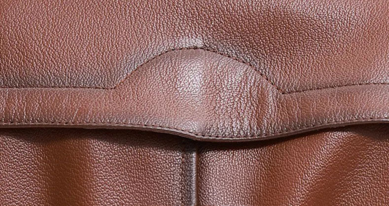 Men’s cowhide leather trench coat in Nutmeg, back storm flap detail — From Borcelleclothes.