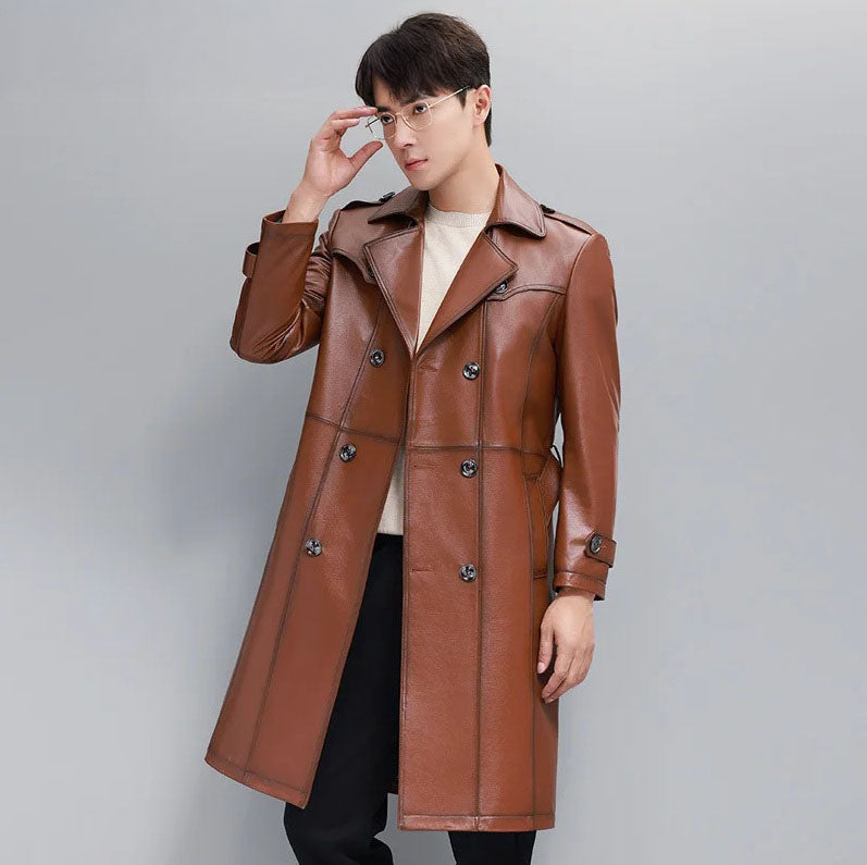 Men’s cowhide leather trench coat in Nutmeg, model adjusting glasses — From Borcelleclothes.