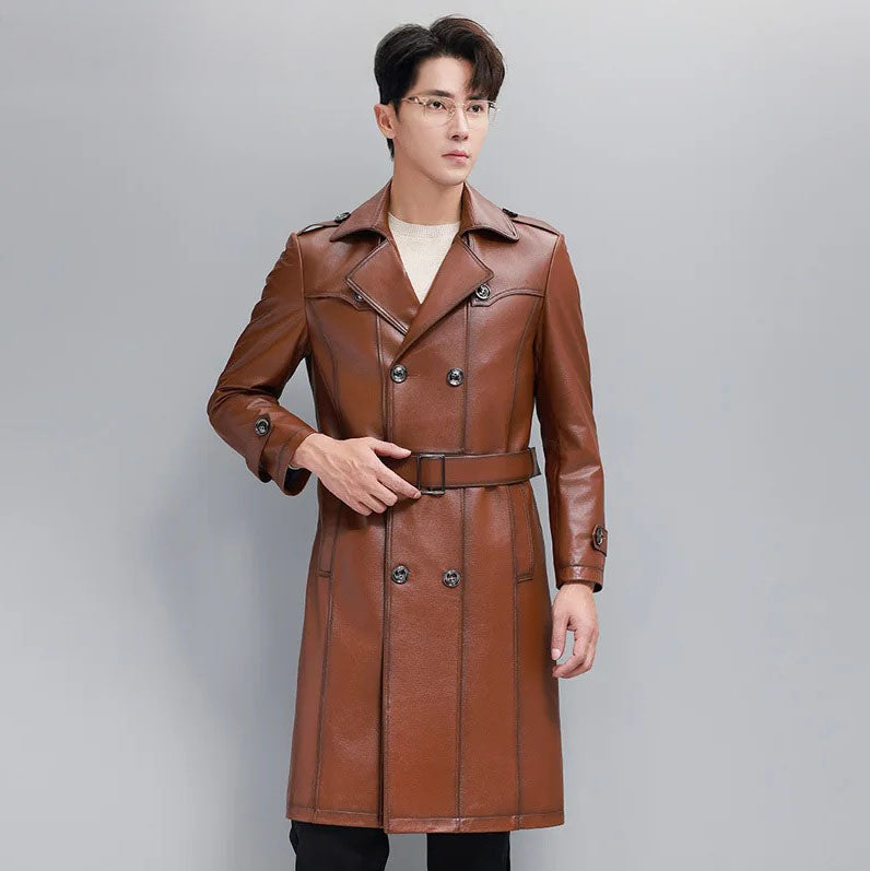 Men’s cowhide leather trench coat in Nutmeg, model holding the belt — From Borcelleclothes.