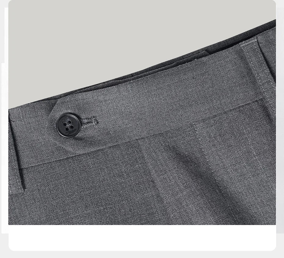 Close-up of the trousers’ horn button closure — understated and functional. From Borcelleclothes.