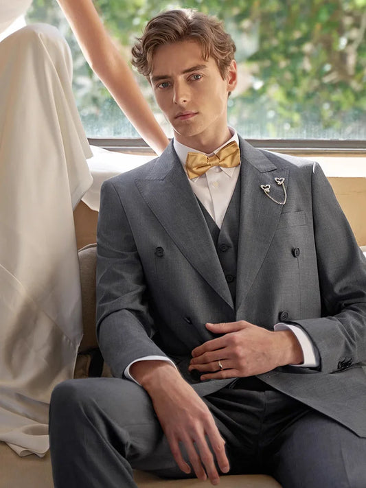 Men’s three-piece suit in Davy Grey with double-breasted blazer and peaked lapels — a soft, structured take on modern formality. From Borcelleclothes.