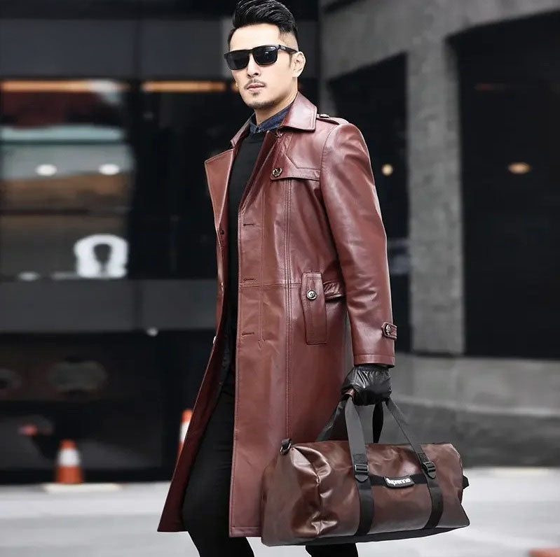 Men’s Deep Coffee cowhide leather trench coat, model holding oversized bag — From Borcelleclothes.