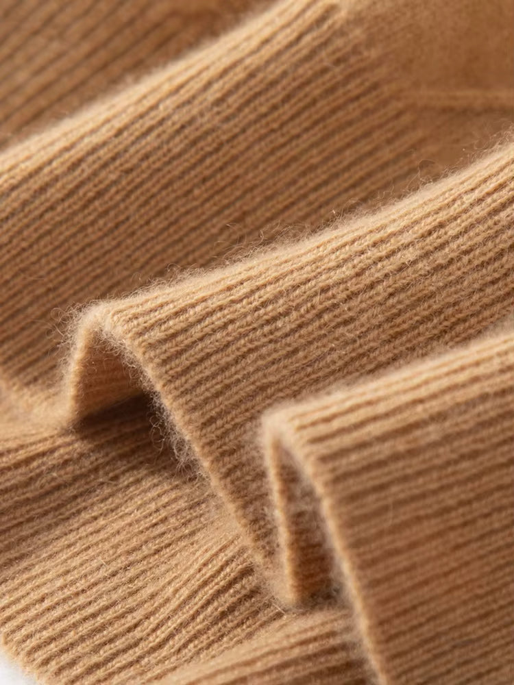 Bottom hem of men’s diamond-stitch cashmere sweater in Lion color, finished with ribbing — From Borcelleclothes.
