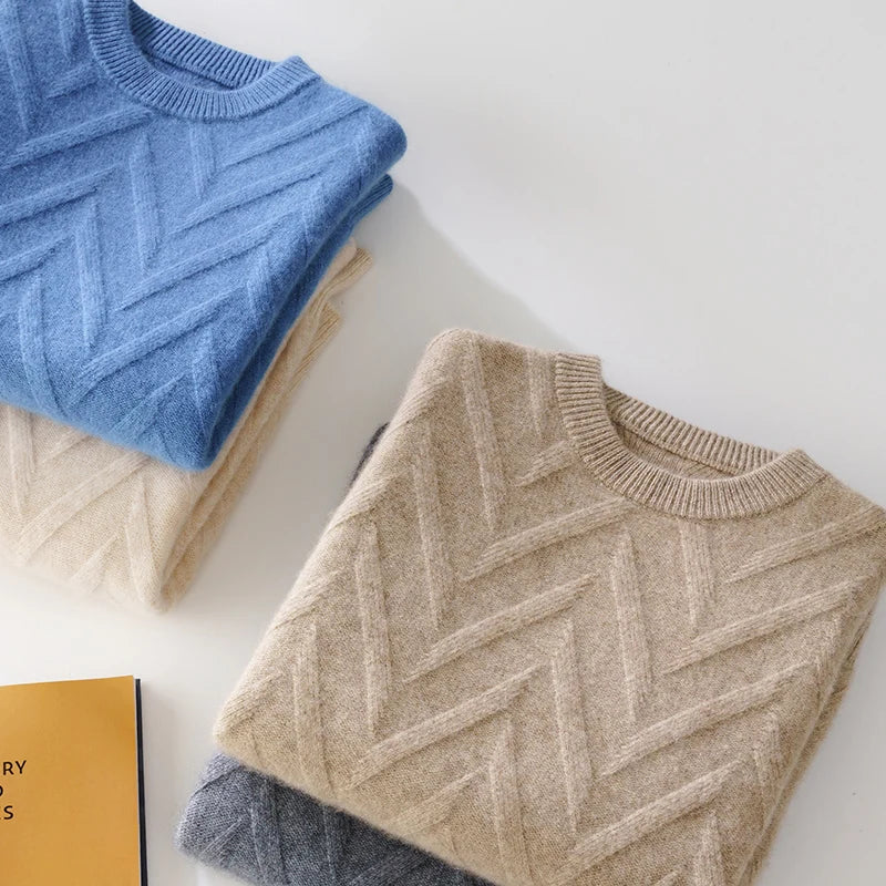 Two stacks of Men's Dimensional Abstract Sprouts Cashmere Sweaters in Sandrift and Mid Grey, and Almond and Dusky Blue, showcasing their elegant shades and luxurious textures. From Borcelleclothes.