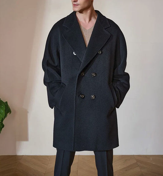 Men’s Double-Breasted Cashmere Coat in Black Pearl, crafted from a luxurious blend of cashmere and high-count wool. Featuring a fluid silhouette, integrated sleeve construction, and a refined six-button front closure. From Borcelleclothes.