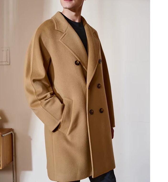 Men’s Double-Breasted Cashmere Coat in Light Taupe, model slightly turned to the side, showcasing its soft structure and tailored proportions. From Borcelleclothes.